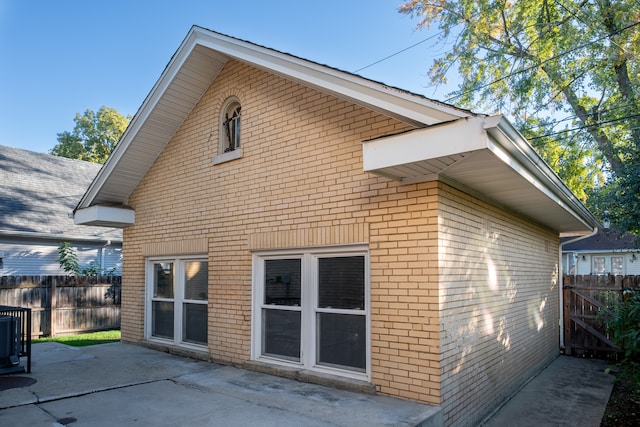 rear view of property featuring a patio area