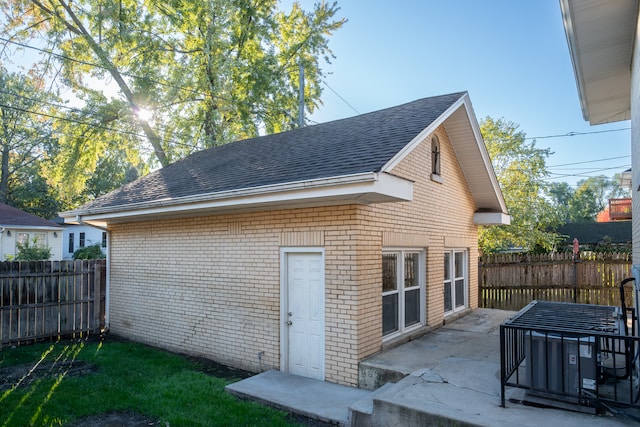 back of property with a patio