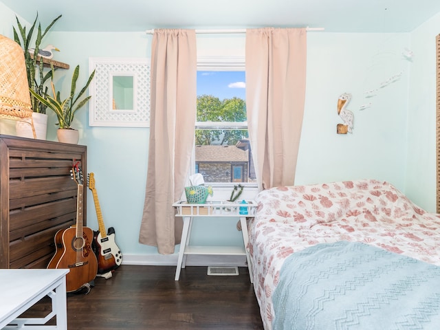 bedroom featuring dark wood-type flooring