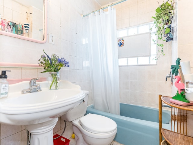 bathroom with shower / tub combo with curtain, tile walls, and toilet