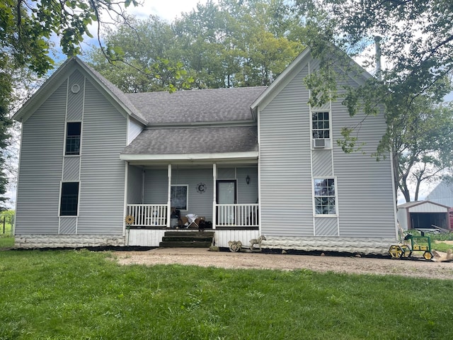 view of front of home featuring a front yard and a porch