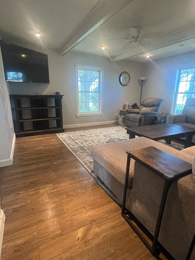 unfurnished living room with a healthy amount of sunlight and wooden walls