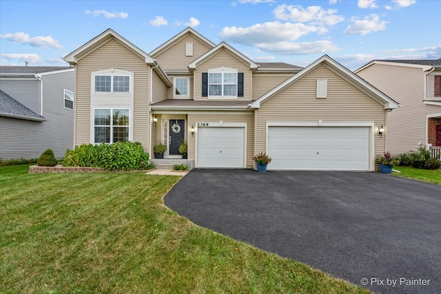 view of front facade with a front yard and a garage