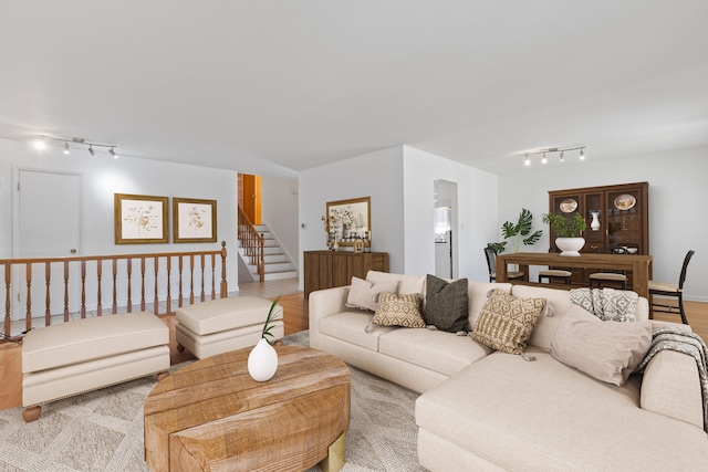 living room featuring track lighting and light hardwood / wood-style flooring