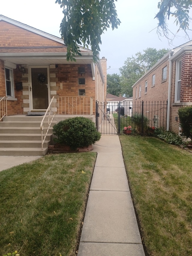 view of home's exterior with a lawn and covered porch