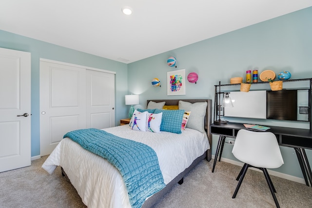 bedroom with light colored carpet and a closet