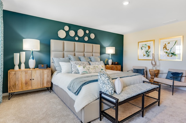 bedroom with light colored carpet