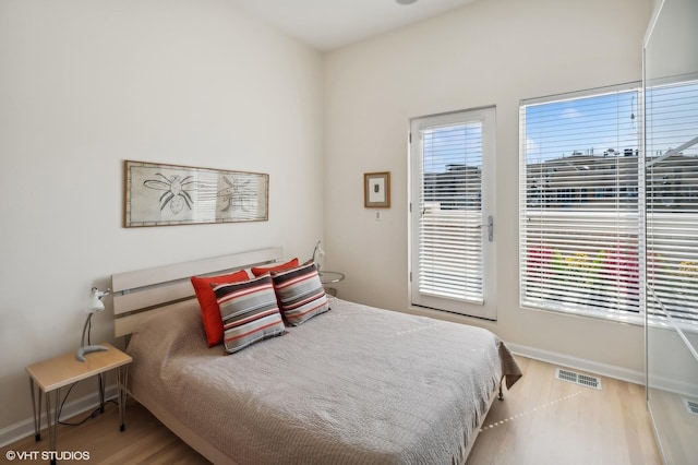 bedroom featuring hardwood / wood-style floors