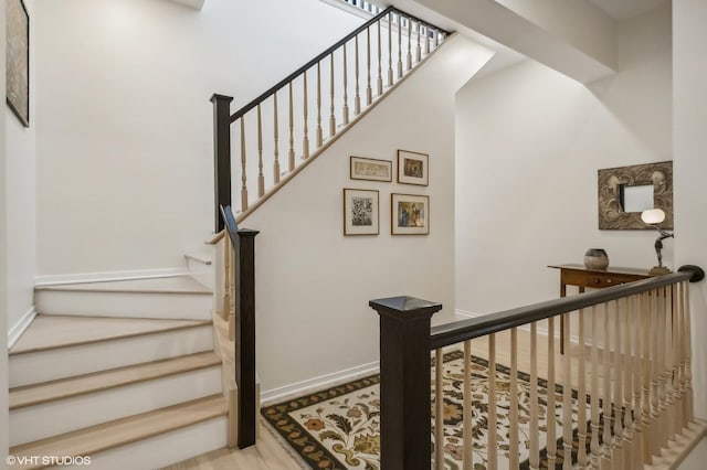 stairway featuring hardwood / wood-style floors