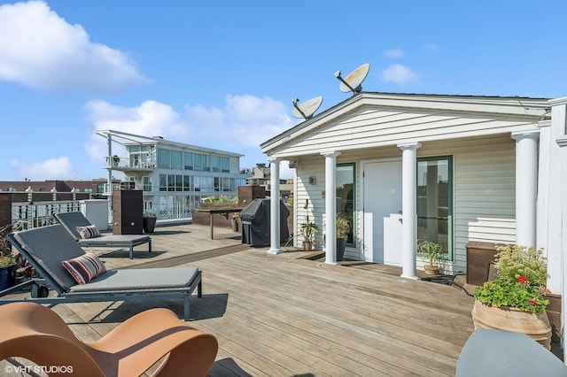 wooden deck featuring grilling area