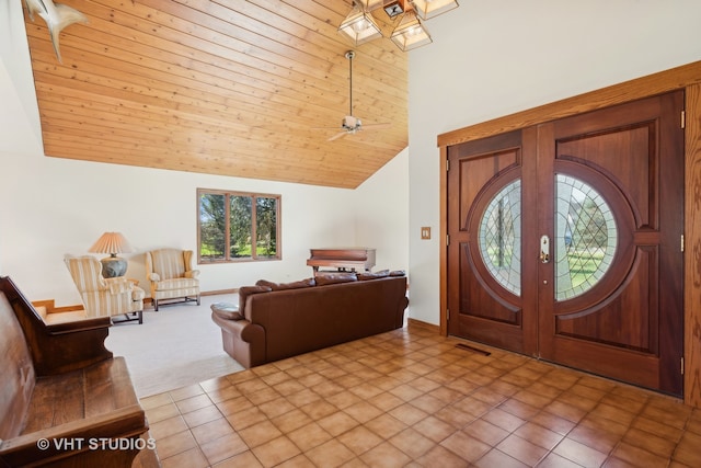 carpeted entryway featuring ceiling fan, french doors, wood ceiling, and vaulted ceiling