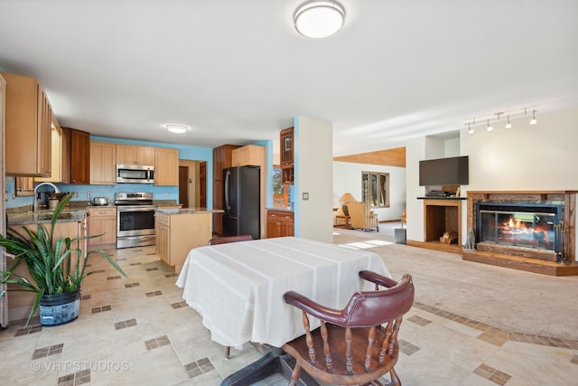 dining room with light tile patterned floors and sink