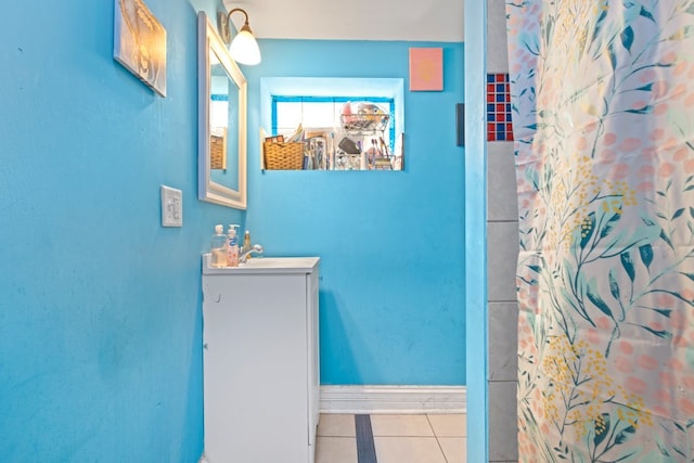 4035 W Marquette Rd, Chicago, IL 60629 - full bathroom featuring tile patterned flooring, vanity, baseboards, and curtained shower