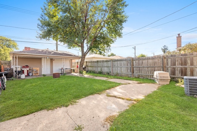4035 W Marquette Rd, Chicago, IL 60629 - view of yard with central AC and a garage