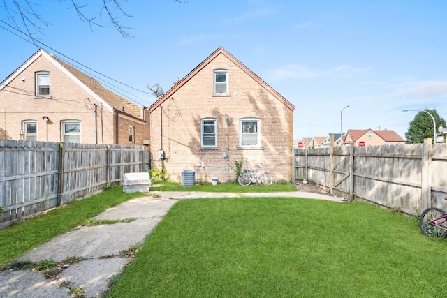4035 W Marquette Rd, Chicago, IL 60629 - back of house with brick siding and central AC unit