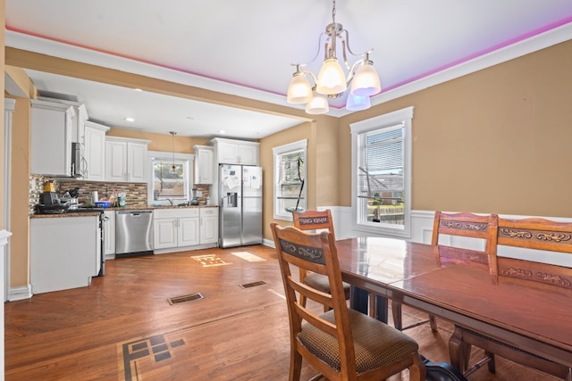 4035 W Marquette Rd, Chicago, IL 60629 - dining area featuring a chandelier, light wood finished floors, and recessed lighting