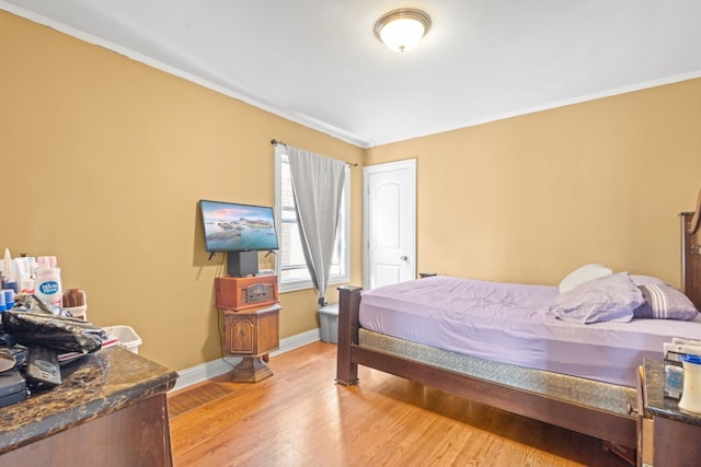 4035 W Marquette Rd, Chicago, IL 60629 - bedroom with baseboards, light wood-style flooring, and ornamental molding