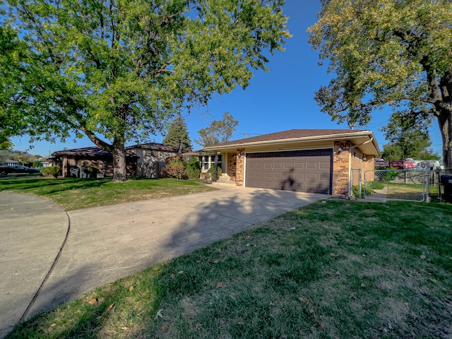 ranch-style home featuring a front yard and a garage