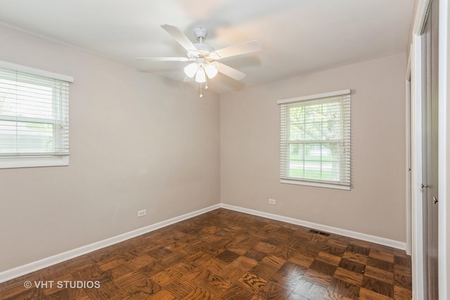 819 Oxford St, Downers Grove, IL 60516 - unfurnished bedroom with baseboards, visible vents, and ceiling fan