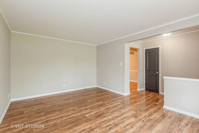 819 Oxford St, Downers Grove, IL 60516 - unfurnished room featuring crown molding, visible vents, wood finished floors, and baseboards