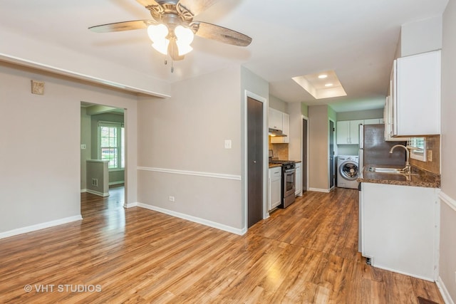 819 Oxford St, Downers Grove, IL 60516 - kitchen with a sink, light wood-type flooring, washer / dryer, decorative backsplash, and gas stove