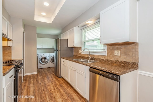 819 Oxford St, Downers Grove, IL 60516 - kitchen with wood finished floors, a sink, stainless steel appliances, white cabinetry, and independent washer and dryer