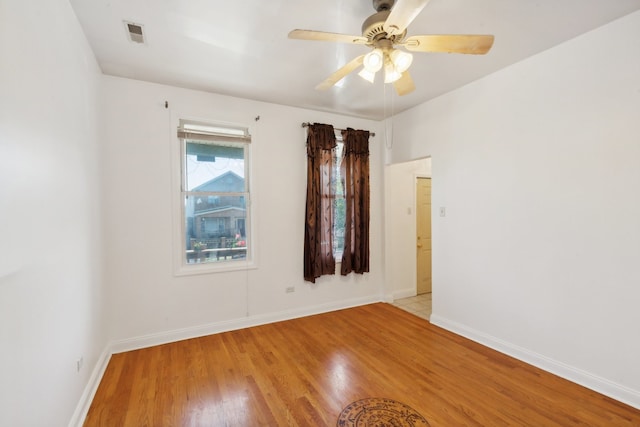 spare room with ceiling fan and light hardwood / wood-style flooring