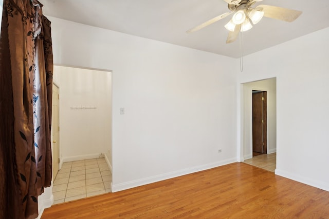 empty room featuring light hardwood / wood-style floors and ceiling fan