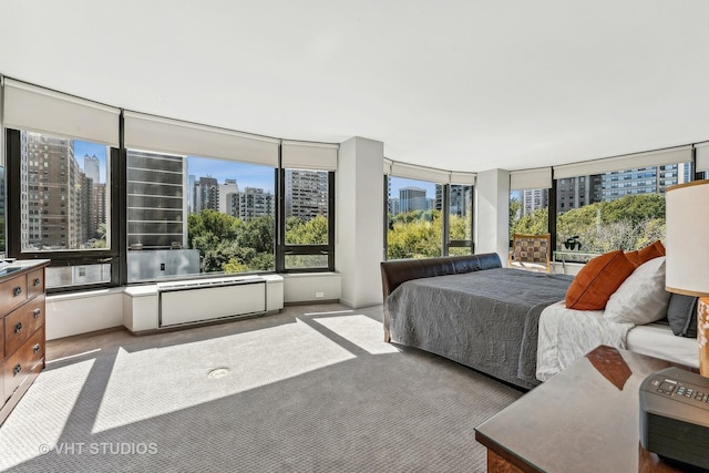 bedroom featuring light carpet