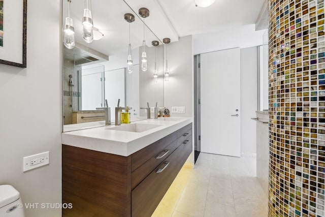 bathroom with vanity and tile patterned flooring