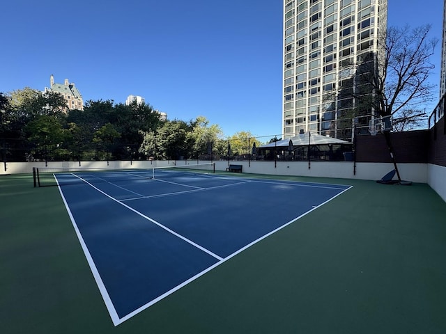 view of sport court with basketball hoop