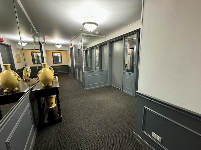 hallway featuring dark colored carpet