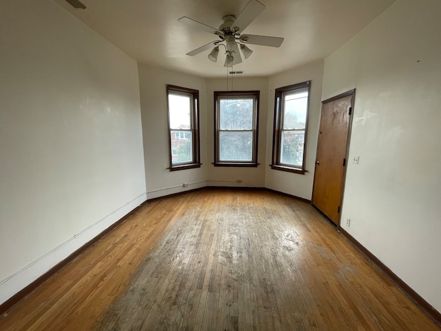 interior space featuring light wood-type flooring and ceiling fan