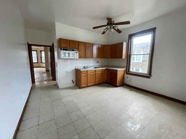 kitchen featuring sink and ceiling fan