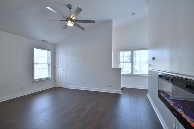 unfurnished living room with ceiling fan, dark hardwood / wood-style flooring, and vaulted ceiling