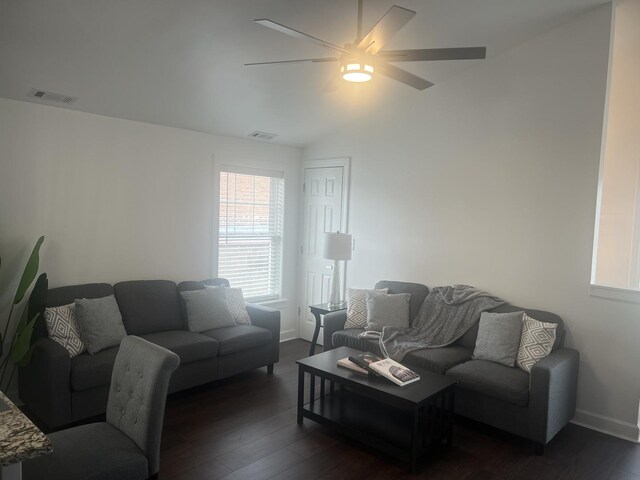 living room featuring lofted ceiling, dark hardwood / wood-style floors, and ceiling fan