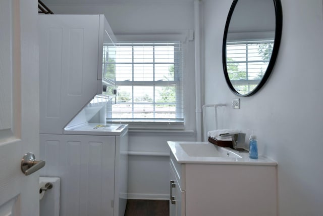 laundry room featuring stacked washer / dryer