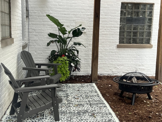 view of patio / terrace with a fire pit