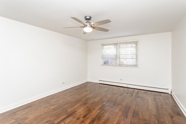 spare room with ceiling fan, dark hardwood / wood-style flooring, and baseboard heating