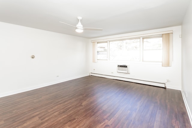 spare room with an AC wall unit, a baseboard heating unit, dark hardwood / wood-style floors, and ceiling fan