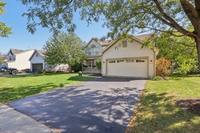 view of front of house with a front lawn and a garage