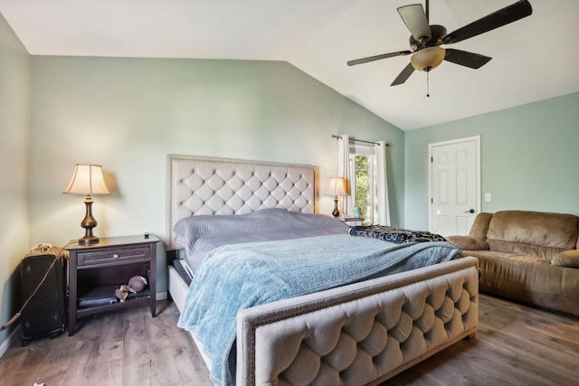 bedroom with vaulted ceiling, hardwood / wood-style floors, and ceiling fan