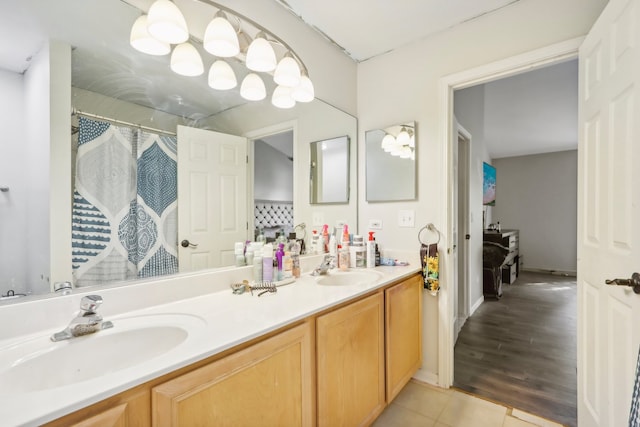 bathroom with a shower with curtain, vanity, and hardwood / wood-style flooring