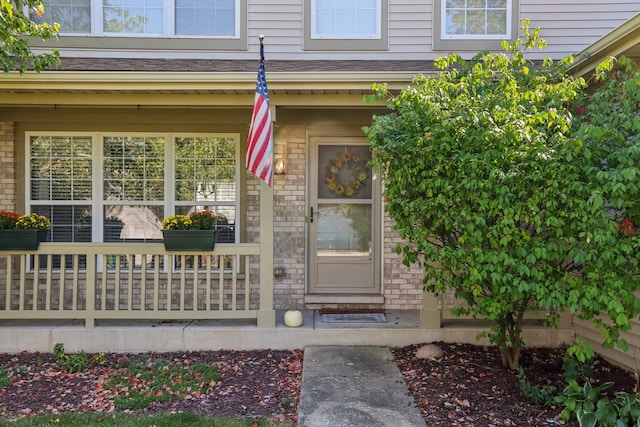 property entrance featuring covered porch