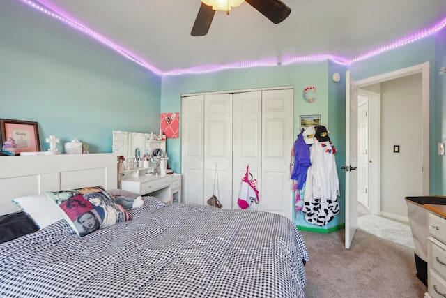 carpeted bedroom with a closet and ceiling fan