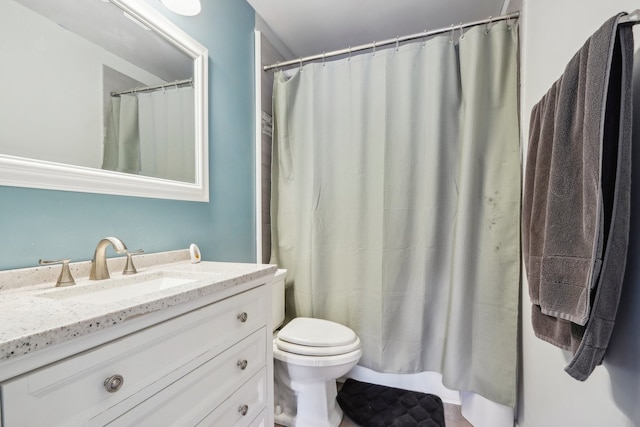 bathroom with vanity, toilet, and a shower with shower curtain