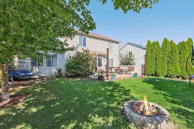 view of yard featuring a patio area and an outdoor fire pit