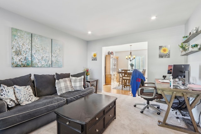 home office featuring a chandelier and light hardwood / wood-style flooring