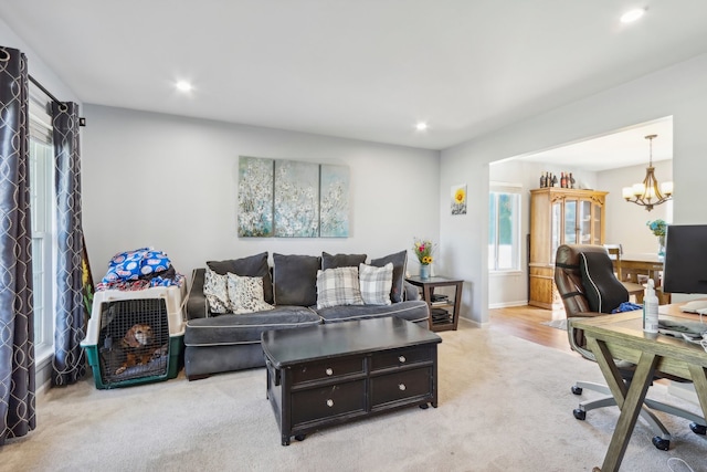 office area featuring light colored carpet and a chandelier