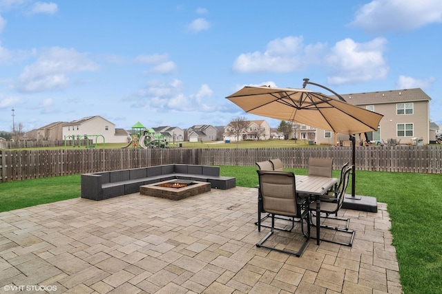 view of patio featuring an outdoor living space with a fire pit